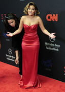 Adrienne Bailon in a red dress