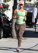 Amber Rose jogging in tights