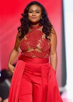 Tatyana Ali in a red dress