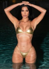 Kim Kardashian Exhibits Her Big Booty In A Golden Bikini