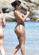 Martina Smeraldi in a tiny bikini on the beach in Mykonos