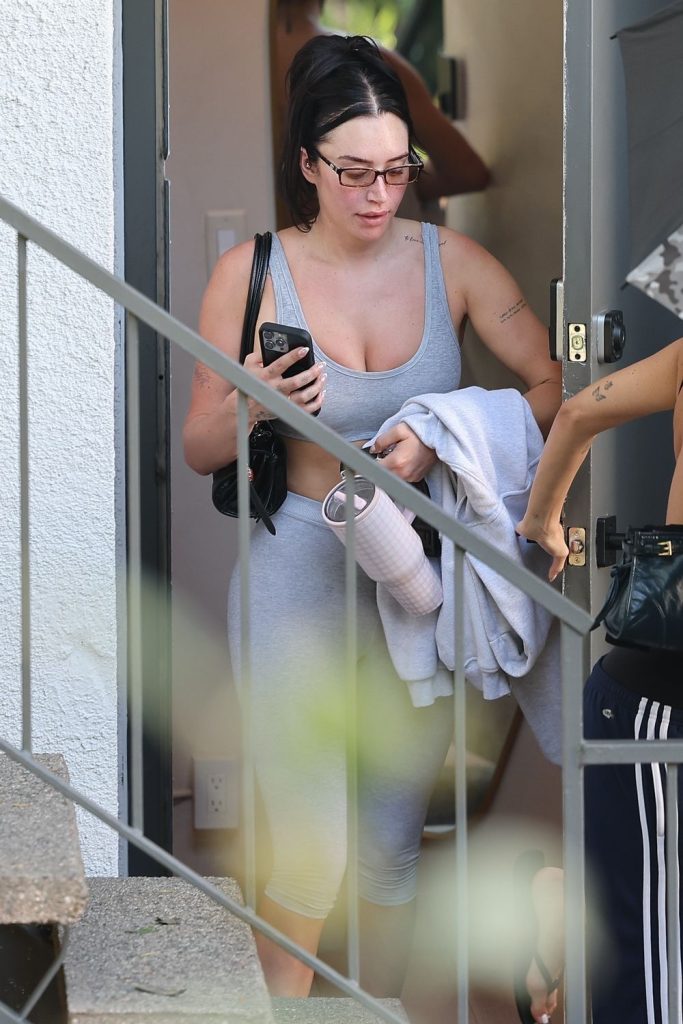 Voyeur view of a woman exiting a building