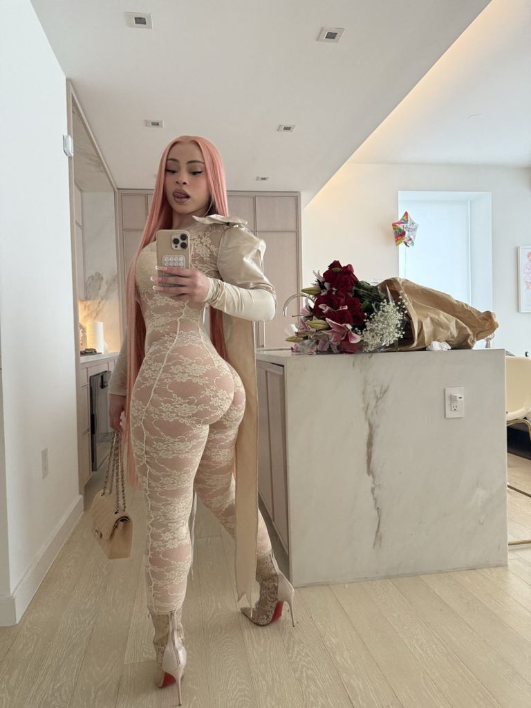 Ice Space showing her backside in a lace body suit for a selfie