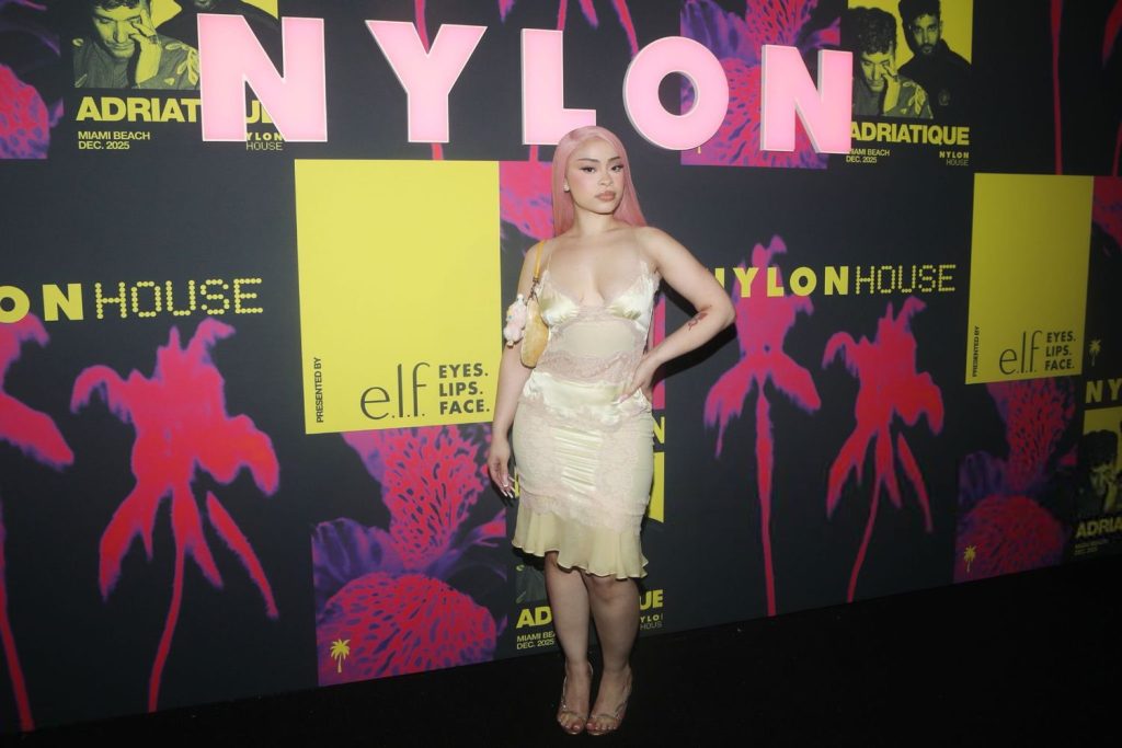 Full body horizontal view of Ice Spice posing with hand on hip