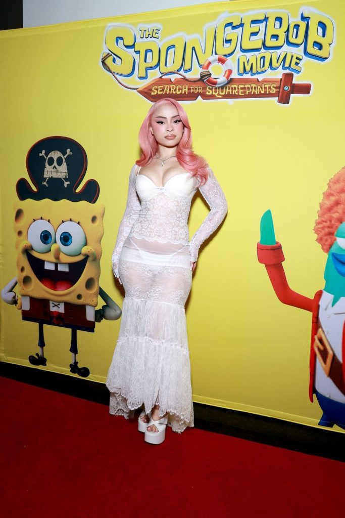 Full body frontal of Ice Spice posing on a red carpet