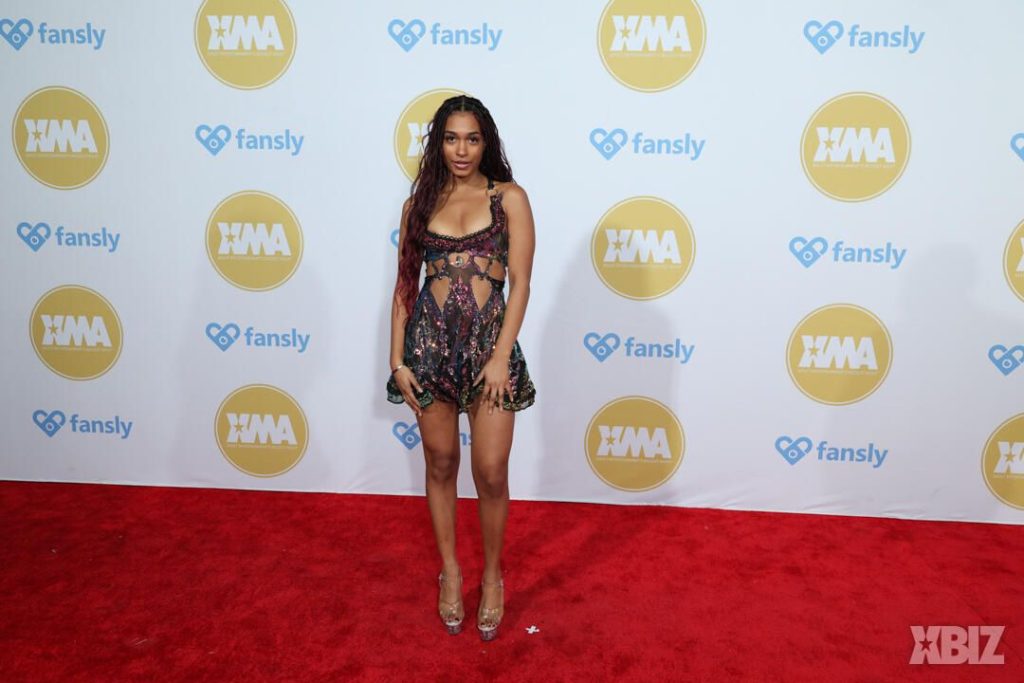Full body frontal of ebony porn star posing on the red carpet