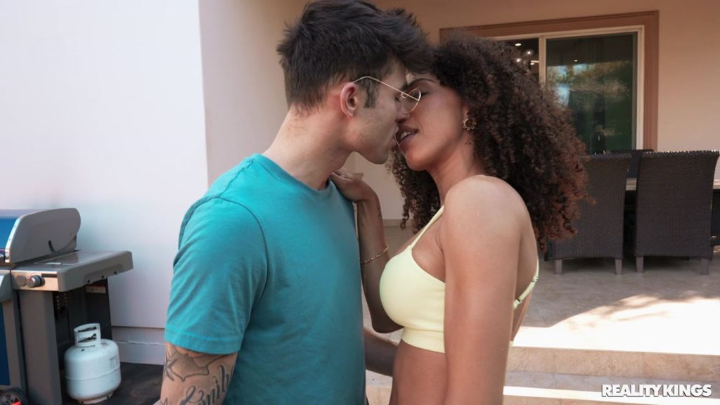 Close up side view of Yoga girl kissing the guy