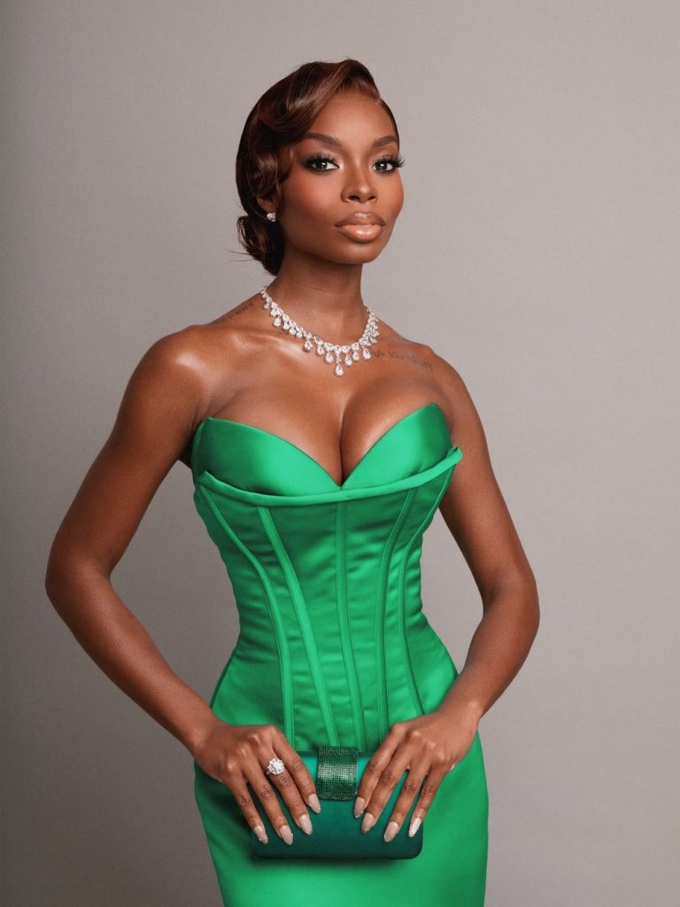 Close up frontal of black woman showing cleavage in a glamour dress