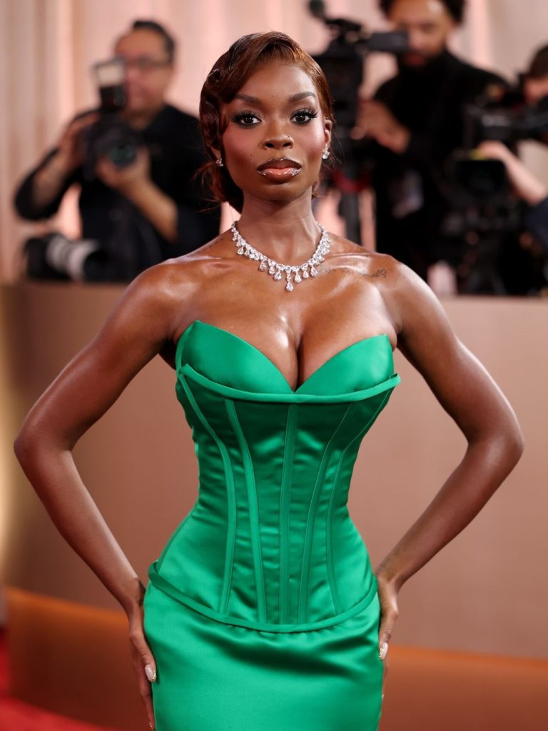 Close up of black woman showcasing her cleavage in a glamour dress