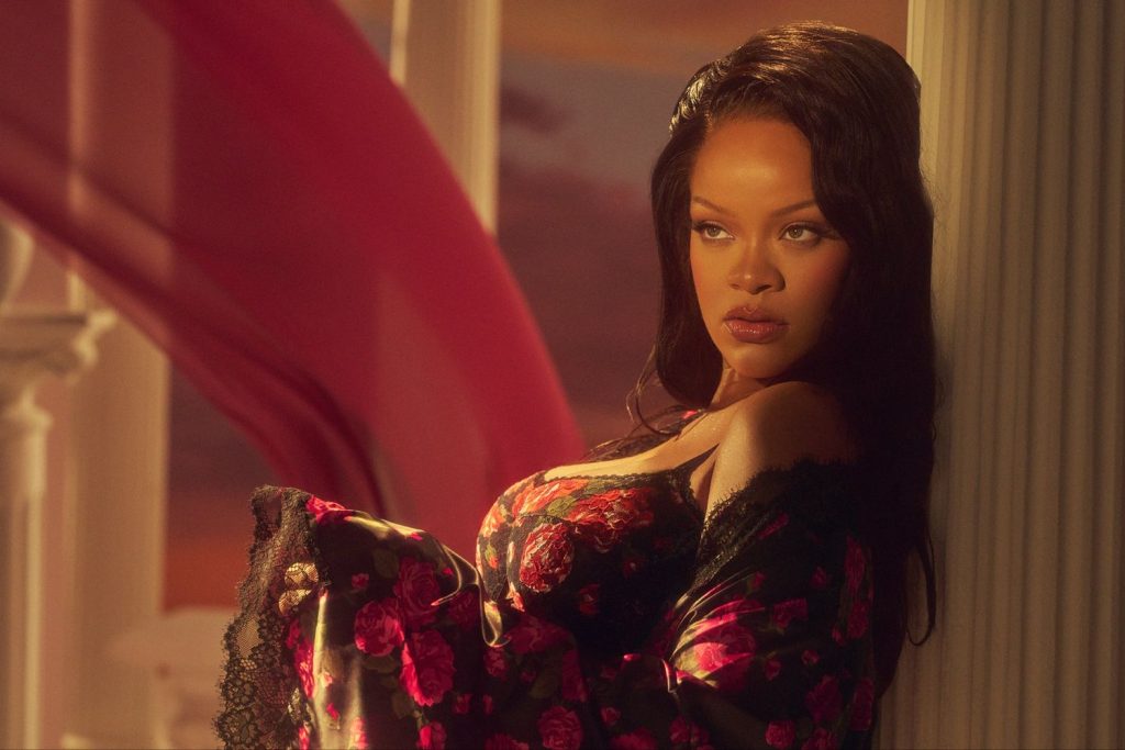 Side view close up of Rihanna wearing a silk robe