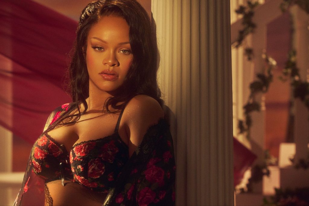 Frontal close up of Rihanna in a flowery bra