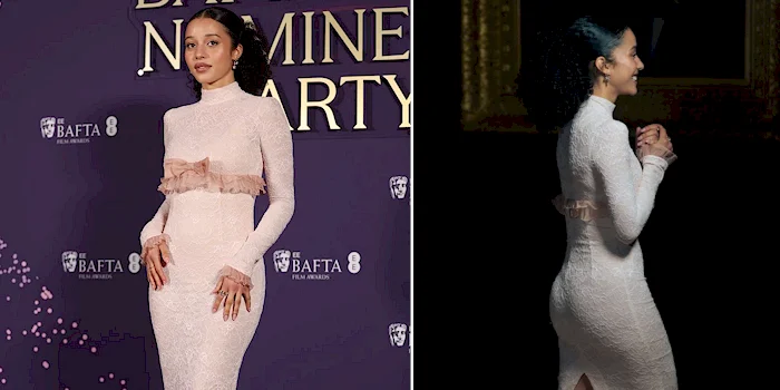 A woman wearing a fitted, long-sleeved, high-neck white dress with a pink ruffle stands posing at a BAFTA event. One image shows her facing forward, while the other is a side profile in dim lighting.