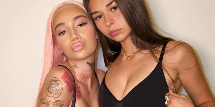 Close up of wwo women posing together, stylishly